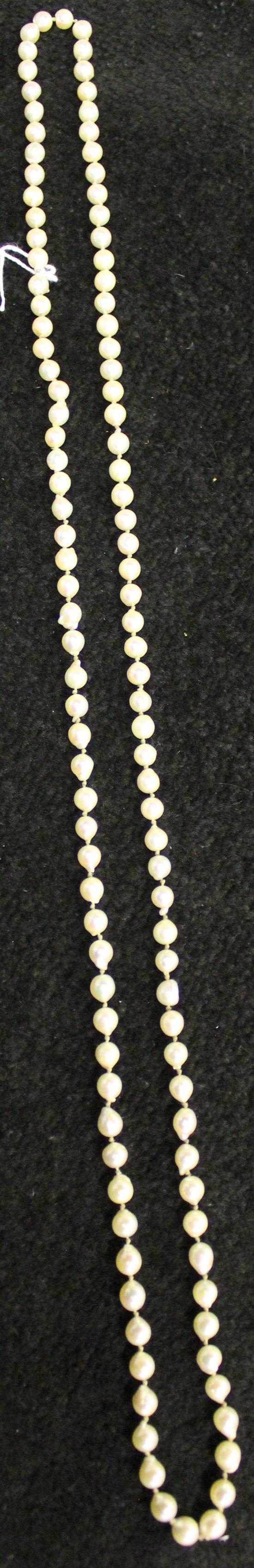 Mikimoto long necklace of uniform pearls